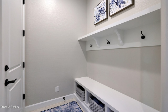 mudroom with tile patterned floors