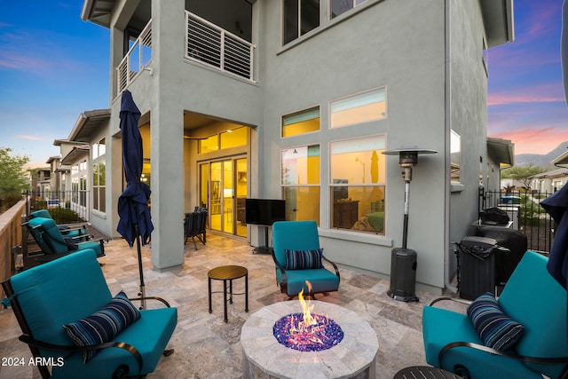 view of patio / terrace featuring an outdoor living space with a fire pit