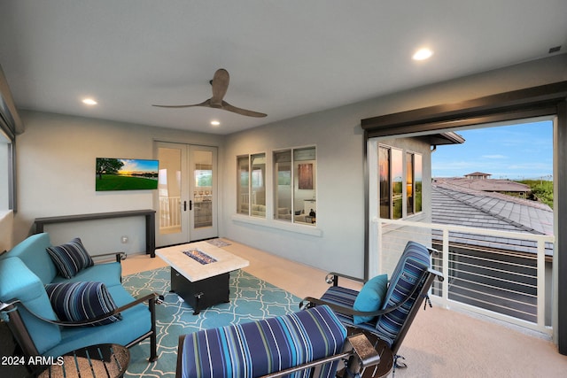 interior space with ceiling fan, french doors, and carpet floors