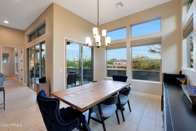 dining area with an inviting chandelier