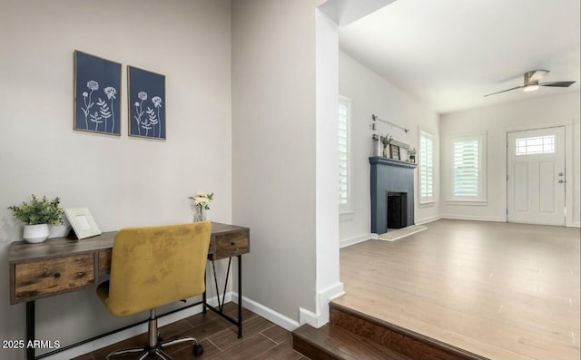 office space with dark hardwood / wood-style floors and ceiling fan