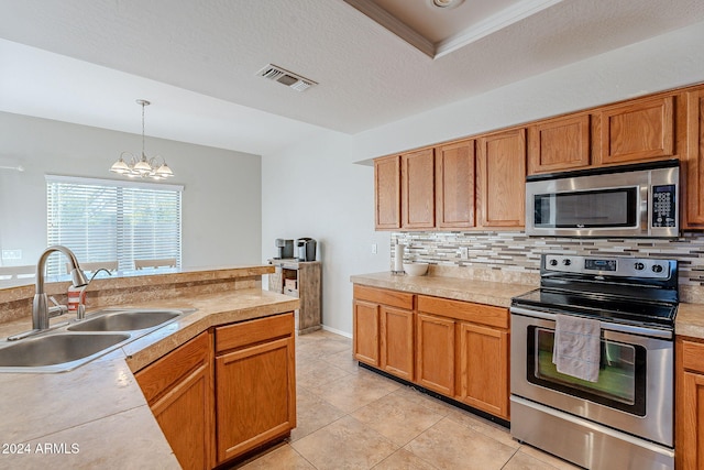 kitchen featuring sink, hanging light fixtures, stainless steel appliances, a chandelier, and light tile patterned floors