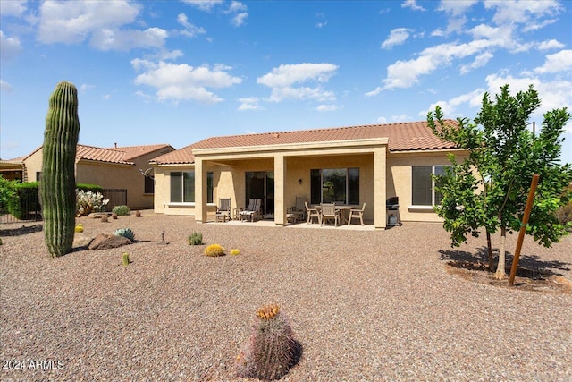 back of house featuring a patio area