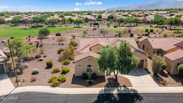 birds eye view of property with a mountain view