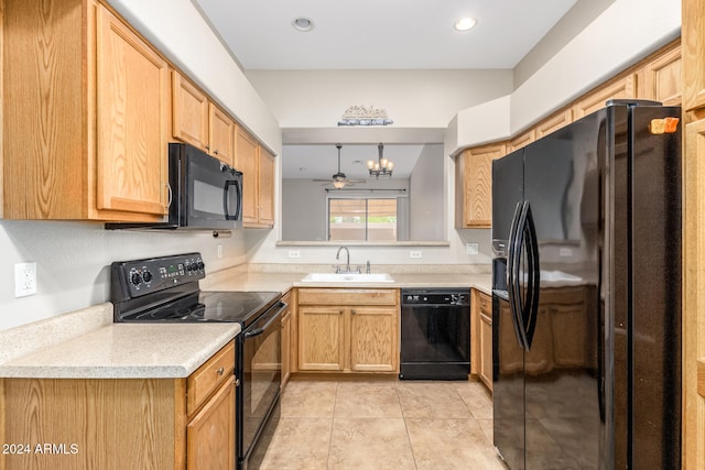 kitchen featuring ceiling fan with notable chandelier, sink, black appliances, decorative light fixtures, and light tile patterned flooring