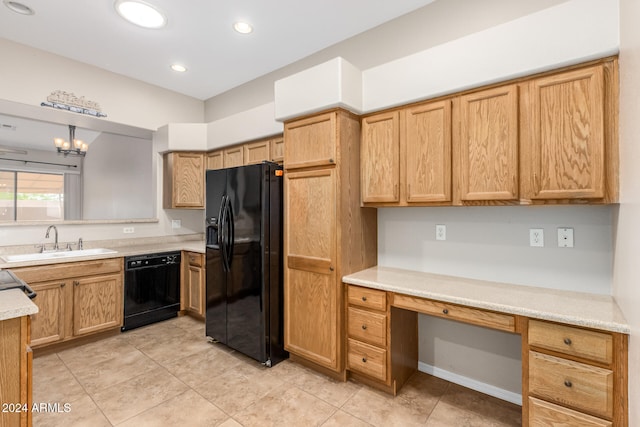 kitchen with sink, black appliances, light tile patterned floors, a notable chandelier, and hanging light fixtures