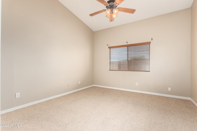 carpeted empty room with ceiling fan and lofted ceiling