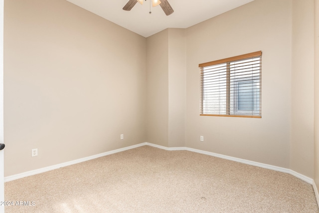 empty room featuring carpet flooring and ceiling fan