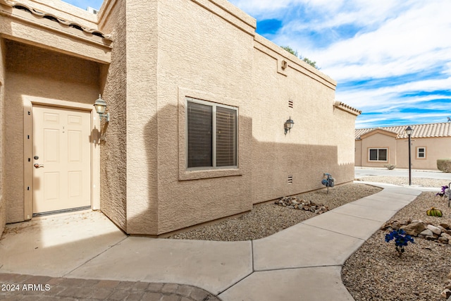 view of side of home featuring a patio