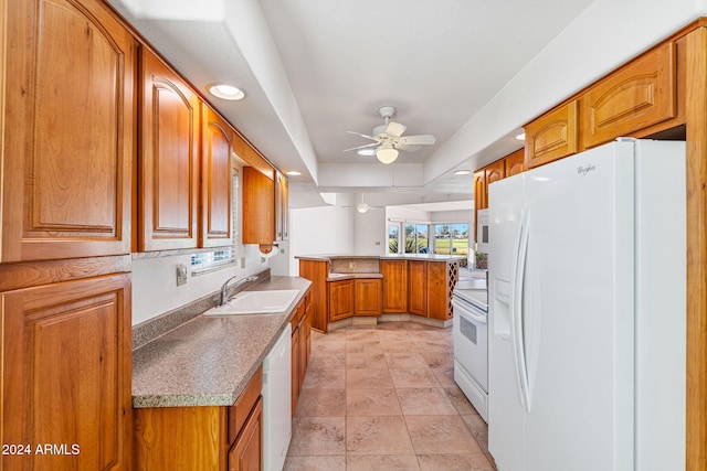 kitchen featuring white appliances, light tile patterned flooring, sink, kitchen peninsula, and ceiling fan