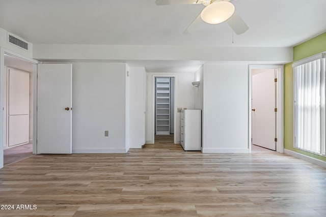 unfurnished bedroom featuring light hardwood / wood-style flooring and ceiling fan