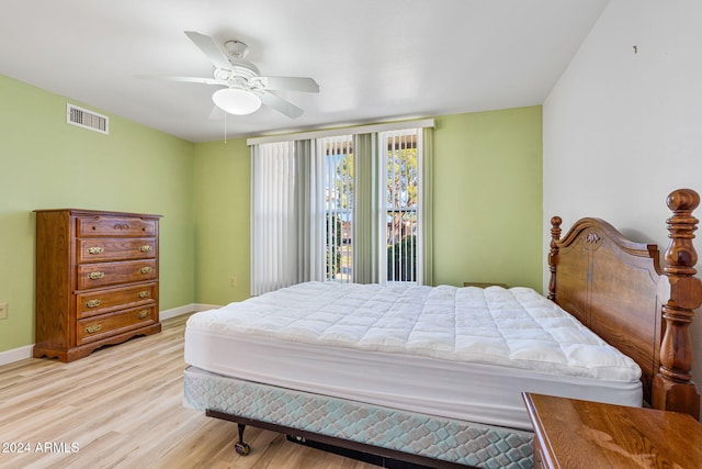 bedroom featuring ceiling fan and light hardwood / wood-style floors