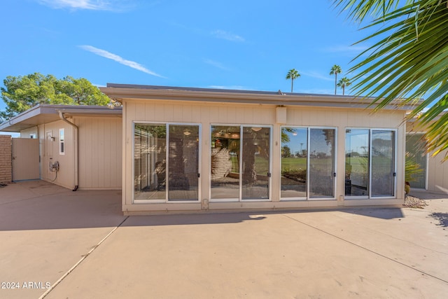 rear view of property featuring a patio area