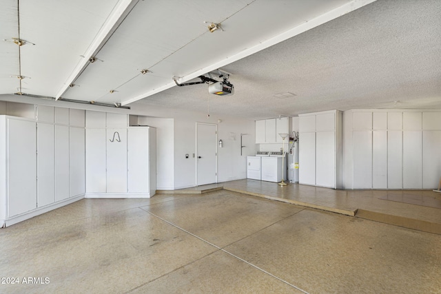 garage featuring a garage door opener and independent washer and dryer