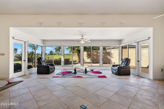 sunroom / solarium with ceiling fan and a wealth of natural light