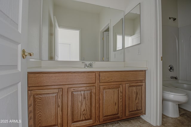 bathroom with toilet, tub / shower combination, and vanity