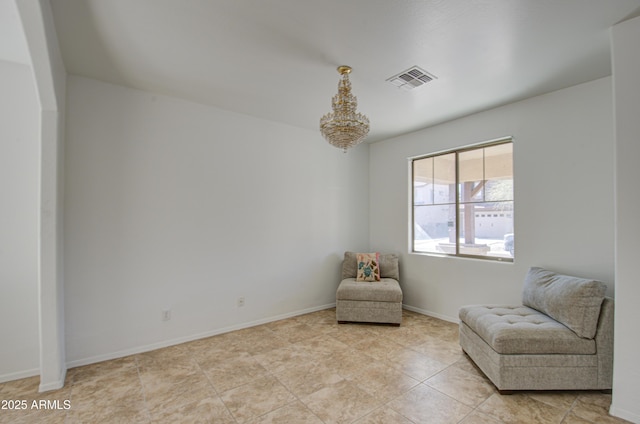 sitting room with visible vents and baseboards