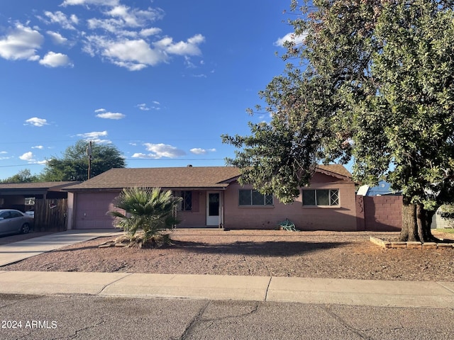 single story home featuring a garage