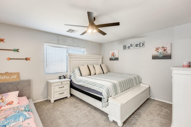 bedroom with ceiling fan and light colored carpet