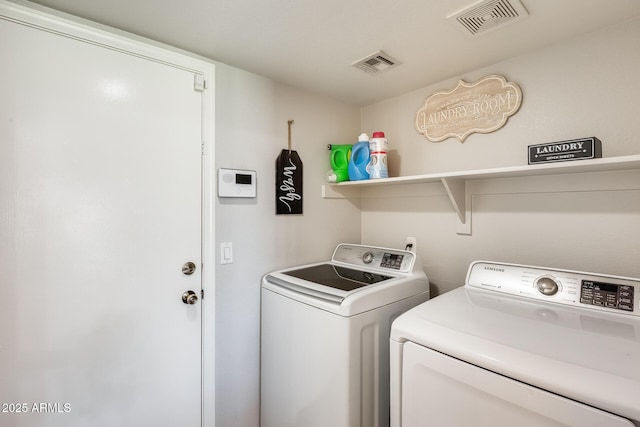 laundry room with washer and clothes dryer