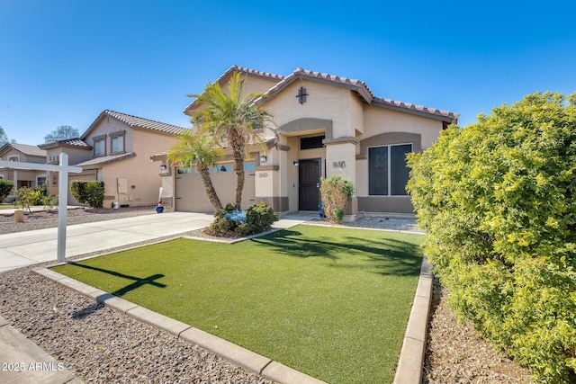 mediterranean / spanish-style home featuring a garage and a front lawn