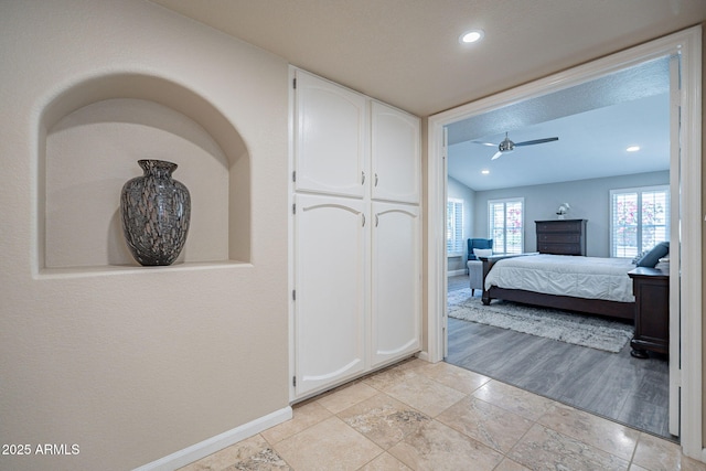 bedroom featuring recessed lighting and baseboards