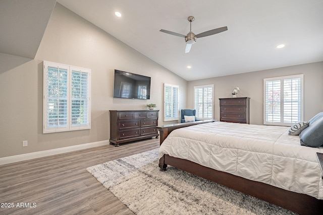 bedroom featuring recessed lighting, multiple windows, light wood-type flooring, and baseboards