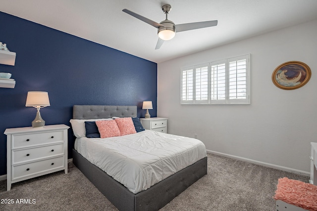 bedroom featuring dark colored carpet, ceiling fan, and baseboards