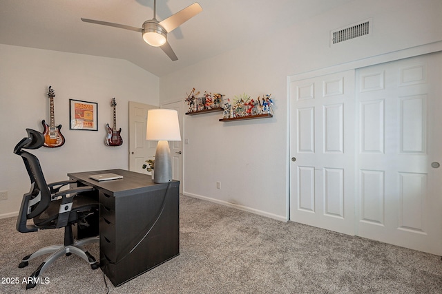 office area featuring lofted ceiling, carpet, visible vents, and a ceiling fan