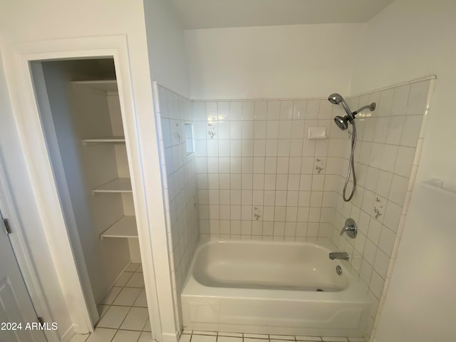 bathroom with tile patterned flooring and tiled shower / bath combo