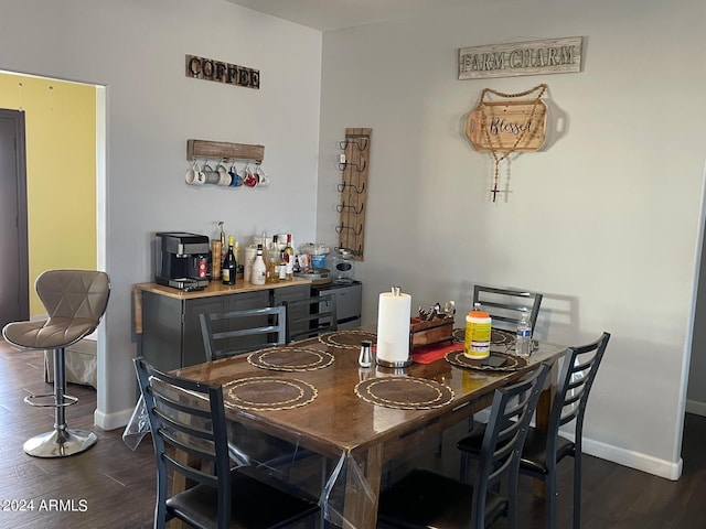 dining area with dark hardwood / wood-style floors