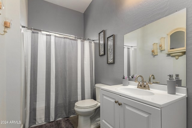 bathroom with a shower with shower curtain, vanity, and toilet