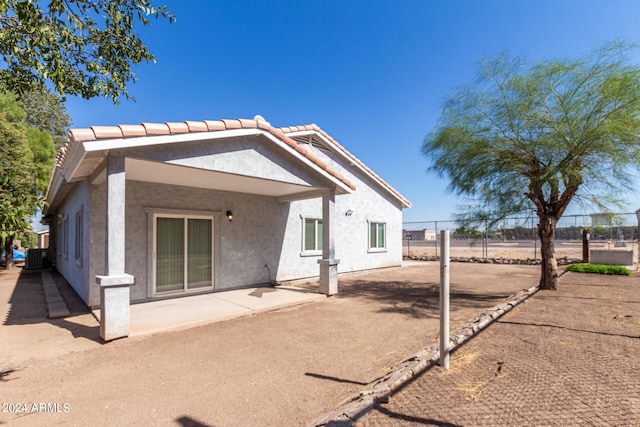 back of property featuring a patio