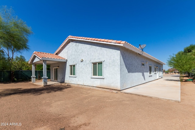 back of property featuring a patio