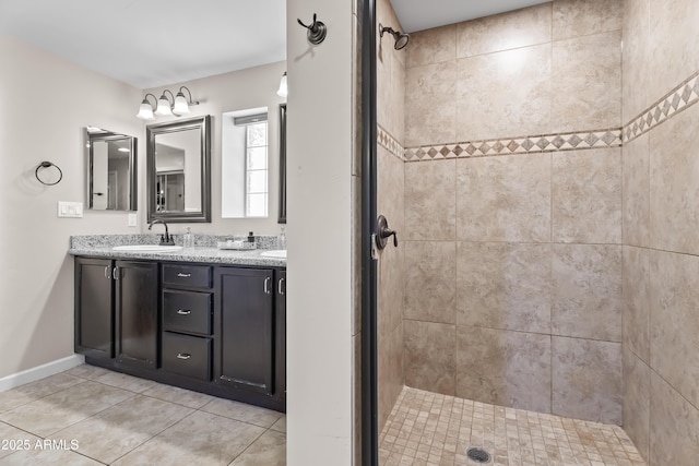 6819 N 10th Pl, Phoenix, AZ 85014 - full bath featuring double vanity, a stall shower, tile patterned flooring, and baseboards