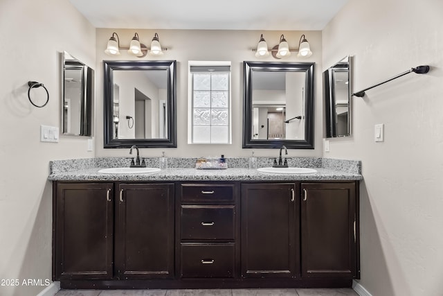 6819 N 10th Pl, Phoenix, AZ 85014 - bathroom featuring double vanity and baseboards