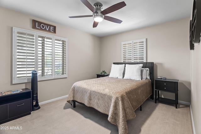 6819 N 10th Pl, Phoenix, AZ 85014 - bedroom featuring light carpet, baseboards, and ceiling fan