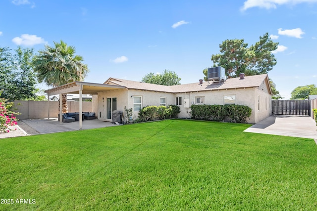 6819 N 10th Pl, Phoenix, AZ 85014 - back of house featuring a patio, stucco siding, outdoor lounge area, and cooling unit