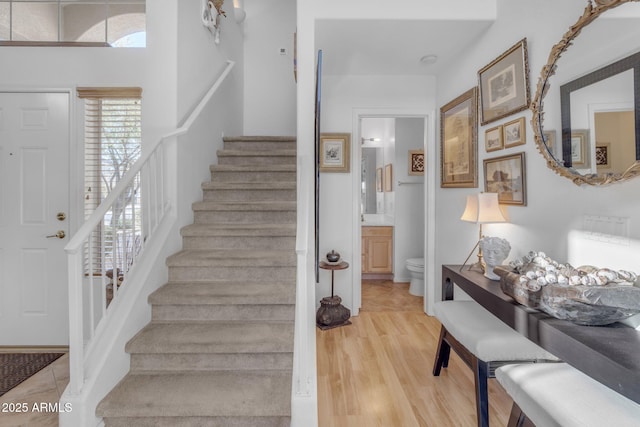 stairs with wood-type flooring