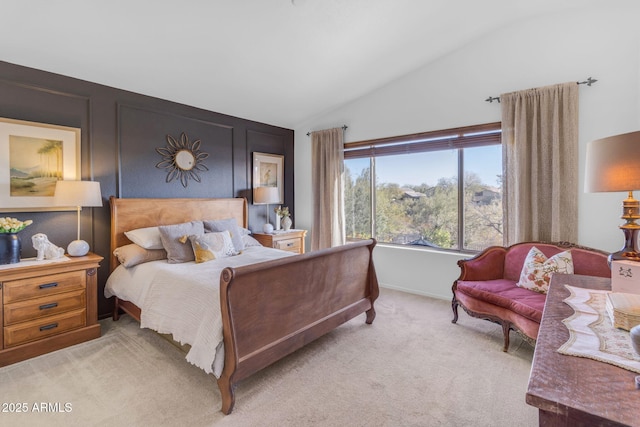 bedroom with light carpet and vaulted ceiling