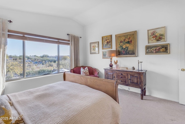 carpeted bedroom featuring vaulted ceiling