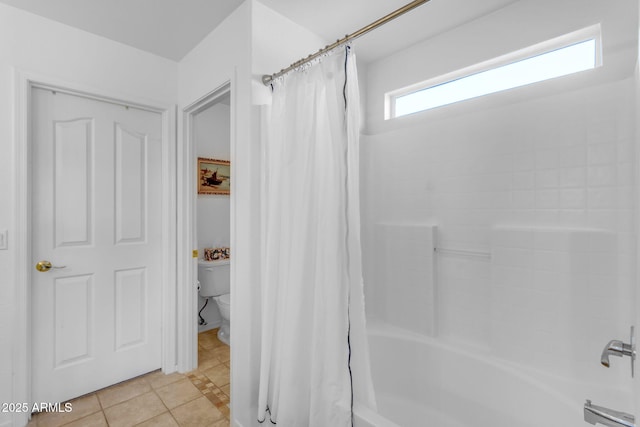 bathroom with toilet, shower / bathtub combination with curtain, and tile patterned flooring