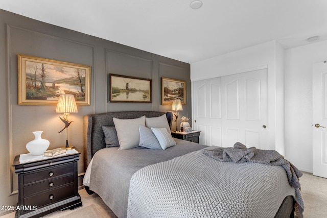 carpeted bedroom with a closet