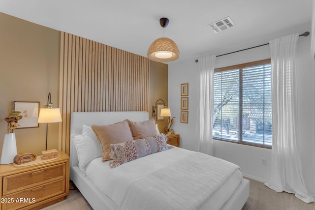 bedroom with light colored carpet