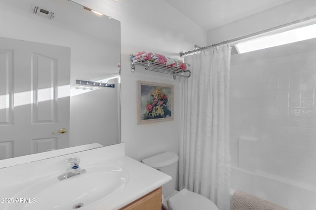 full bathroom featuring vanity, toilet, and shower / bath combo with shower curtain