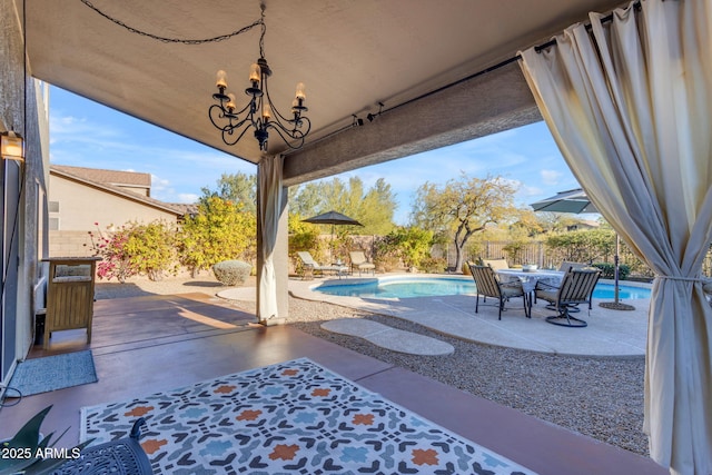 view of patio / terrace with a fenced in pool