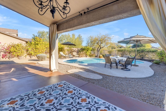 view of patio featuring a fenced in pool