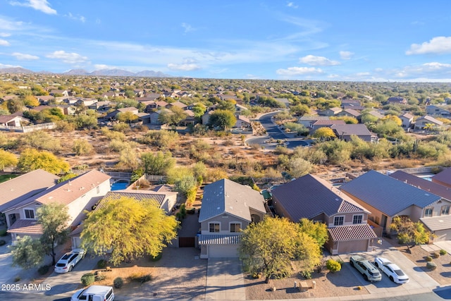 birds eye view of property with a mountain view