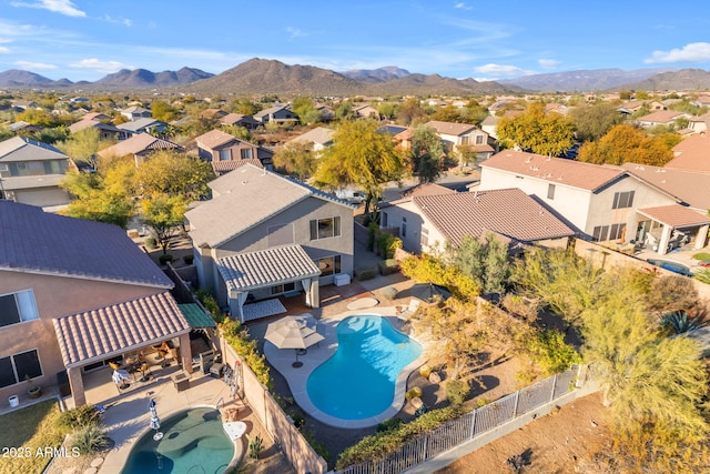 birds eye view of property featuring a mountain view