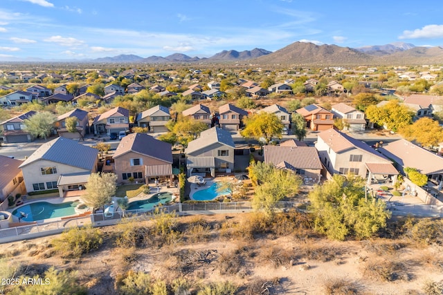 birds eye view of property featuring a mountain view